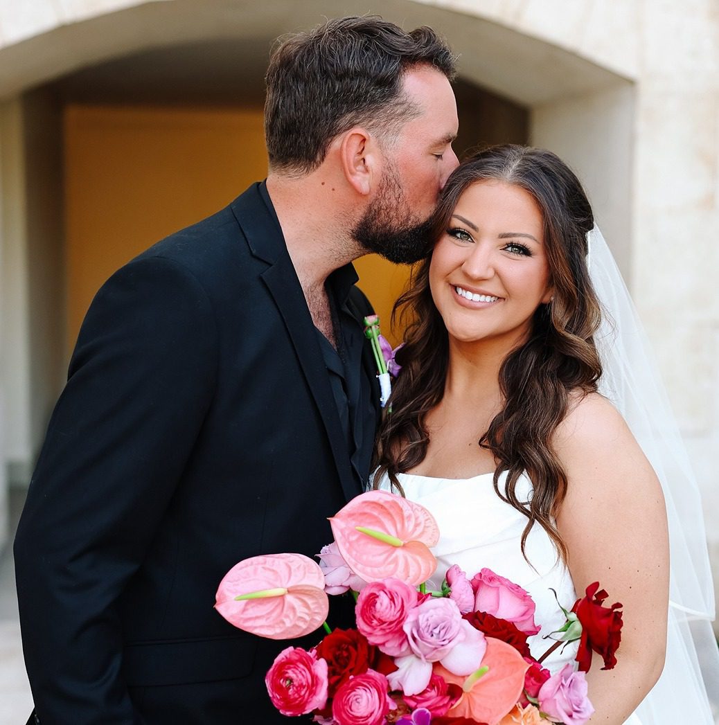 a couple at their cancun all inclusive wedding resorts wedding